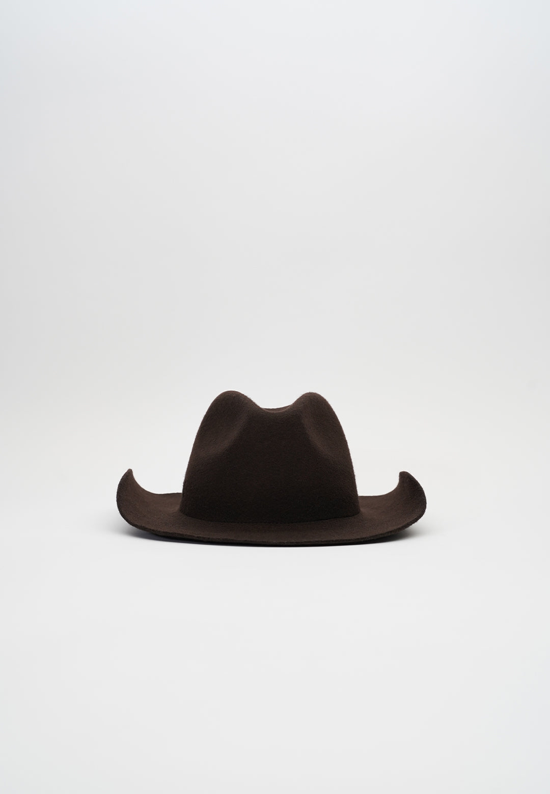 Handcrafted luxury felt hat in a classic cowboy style, made from premium materials. A perfect blend of elegance and Western charm, ideal for fashion-forward individuals and special occasions. N33 PURE CURVED. NTHIRTYTHREE