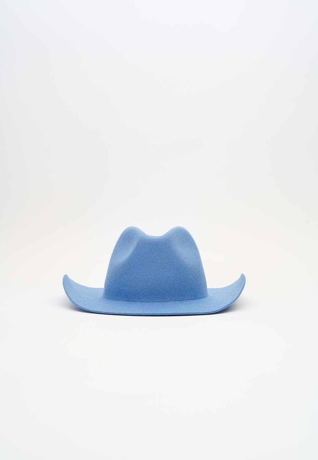 Handcrafted luxury felt hat in a classic cowboy style, made from premium materials. A perfect blend of elegance and Western charm, ideal for fashion-forward individuals and special occasions. N33 PURE CURVED. NTHIRTYTHREE